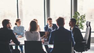 A boardroom of professionals discussing business